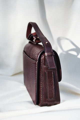 <tc>The Crossbody · Embossed Lizard Leather · Cherry · Limited Edition</tc>